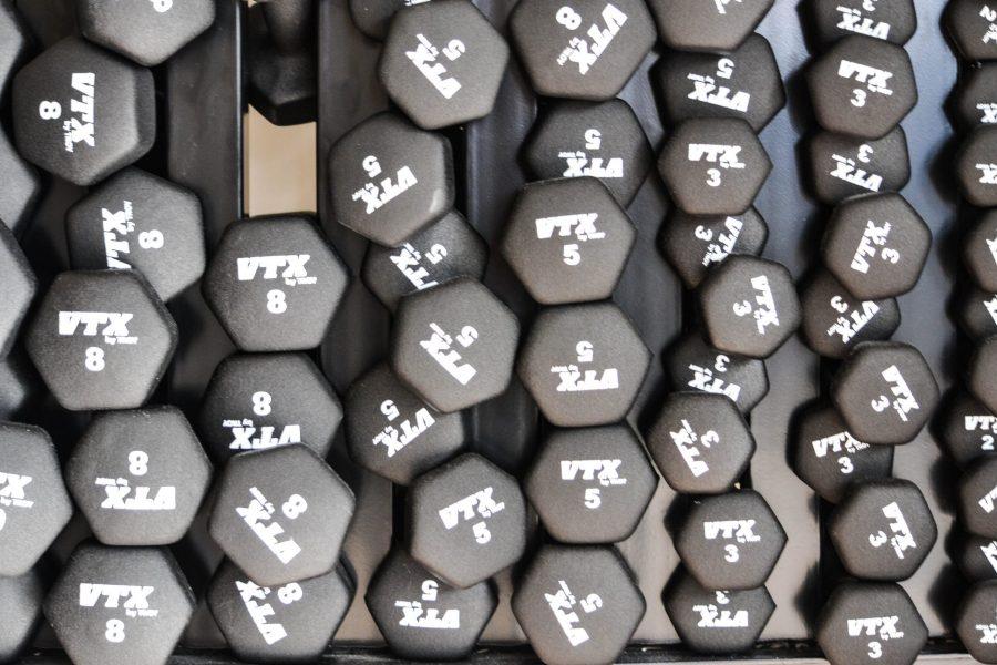 Free weights in a rack. (Collegian File Photo)