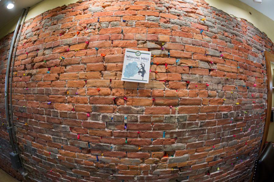 Located in the rear of Happy Luckys Teahouse, the Wishing Wall is where customers can write down a dream of theirs and place it into the wall in hopes it will come true. (Davis Bonner | Collegian)