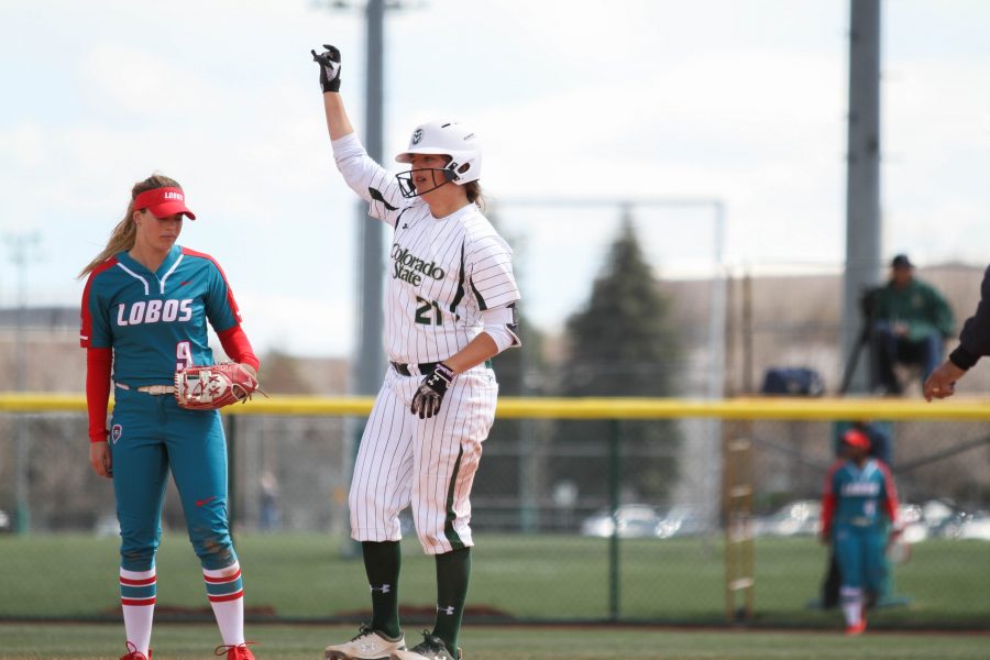 Junior Lauren Buchanan puts up a Rams hand sign after hitting a double during the Rams third game against the University of New Mexico on Sunday, April 8. The Rams beat the Lobos 12-4. (Ashley Potts | Collegian)