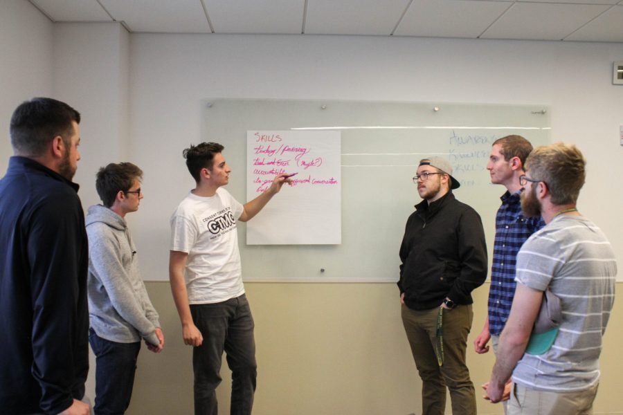 A group of men discuss skills they have and can put to use to advocate for sexual assault survivors and victims during a presentation on men and the #MeToo movement put on by Men in the Movement. (Ashley Potts | Collegian)