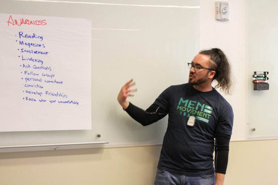 Carl Olsen, Mens Programing and Violence Prevention Coordinator at the Womens and Gender Advocacy Center, gives a presentation on men and the #MeToo movement. (Ashley Potts | Collegian)