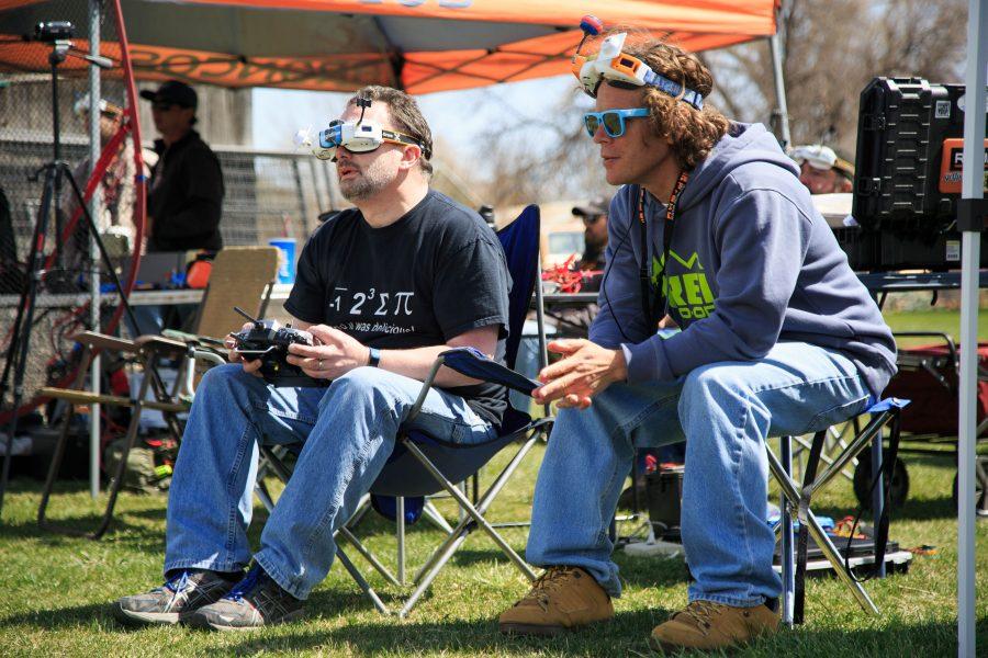 Dean Nicholson (left), a member of FoCo FPV, pilots his drone through a course using first person view (FPV) goggles to navigate while Tom Shope acts as a spotter. (Davis Bonner | Collegian)