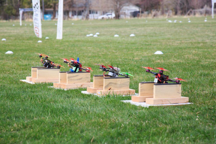 A grouping of four drones prepares to take off and fly laps around FoCo FPVs drone racing track Sunday afternoon. (Davis Bonner | Collegian)