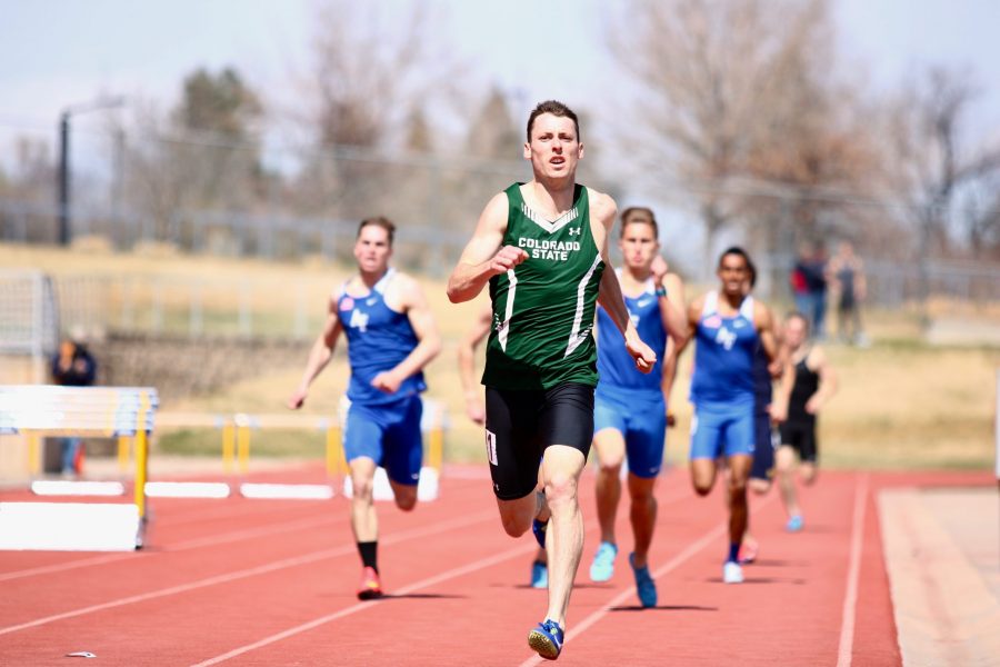 Middle distance runner Blake Yount strides down the home stretch of the track during the 800 meter race in Greeley on Sunday April 15th at the NOCO Challenge meet. Young went on to win the race by 10 meters.