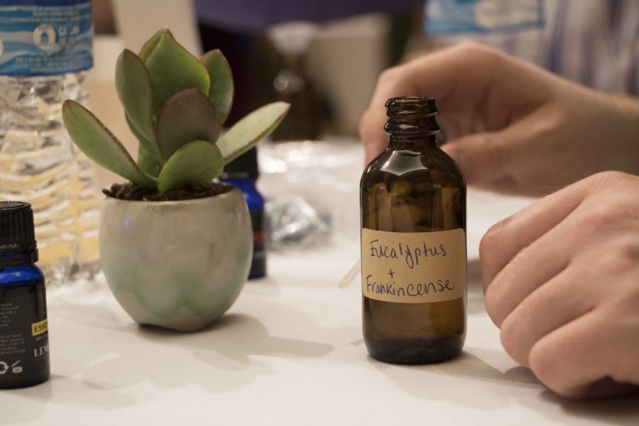 A participant in the #MeToo and Radical Self Love event crafts a personal essential oil bottle to use during times of stress. Essential oils are known to be beneficial both physically and mentally, as they can strengthen skin cells and heal some illnesses as well as ease anxiety and depression, both of which can be effects of sexual assault. (AJ Frankson | Collegian)