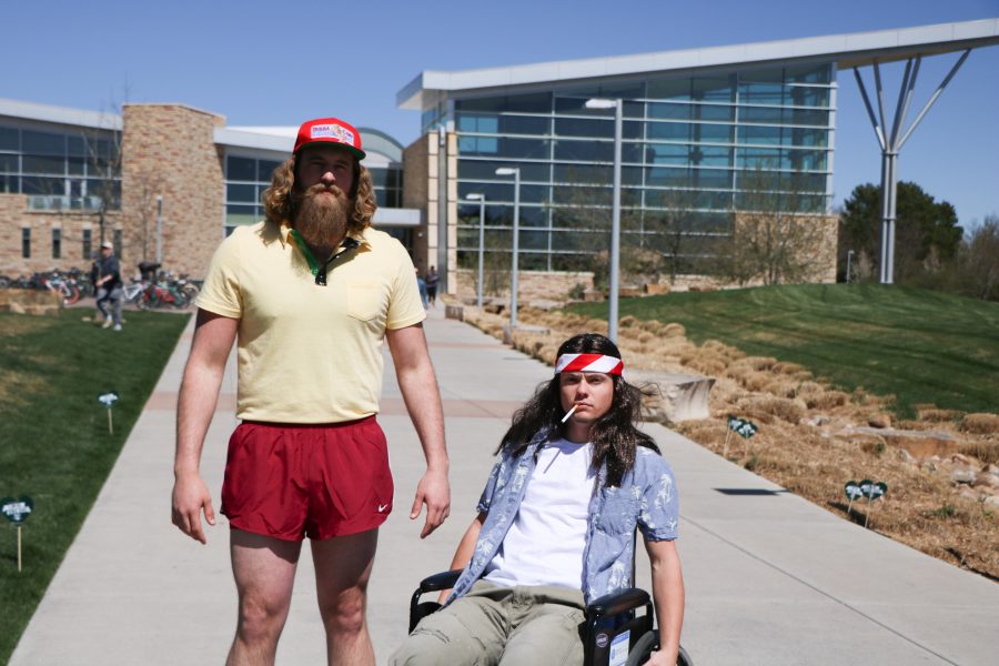 Forrest Gump (Reece Melton) and lieutenant Dan (Brett "Arnie" Arnusch 'smile' for the camera before running around campus. (Devin Cornelius | Collegian)