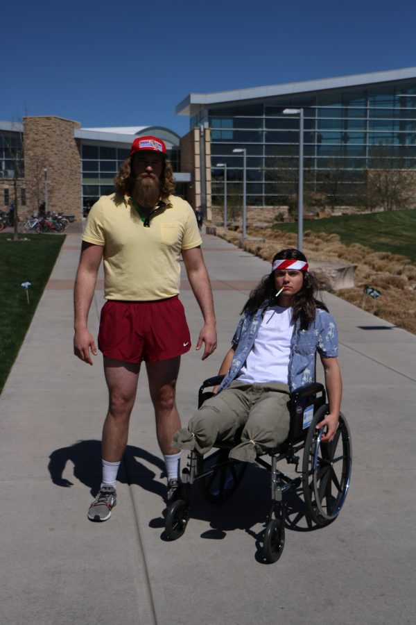 Forrest Gump (Reece Melton) and lieutenant Dan (Brett "Arnie" Arnusch 'smile' for the camera before running around campus. (Devin Cornelius | Collegian)