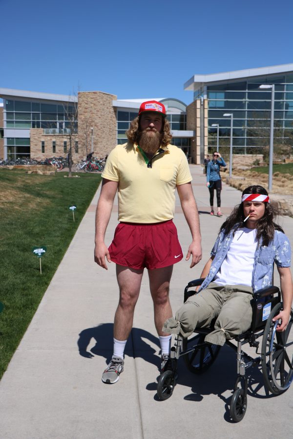 Forrest Gump (Reece Melton) and lieutenant Dan (Brett "Arnie" Arnusch 'smile' for the camera before running around campus. (Devin Cornelius | Collegian)