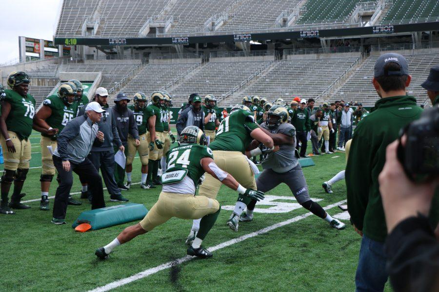 Izzy Mathews as he runs throught the gauntlet at the spring game. ( Devin Cornelius | Collegian)
