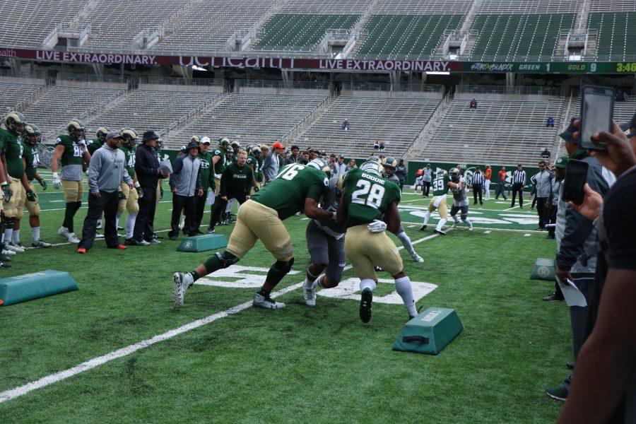 Rashaad Boddie runs the gauntlet during the spring game. (Devin Cornelius | Collegian)