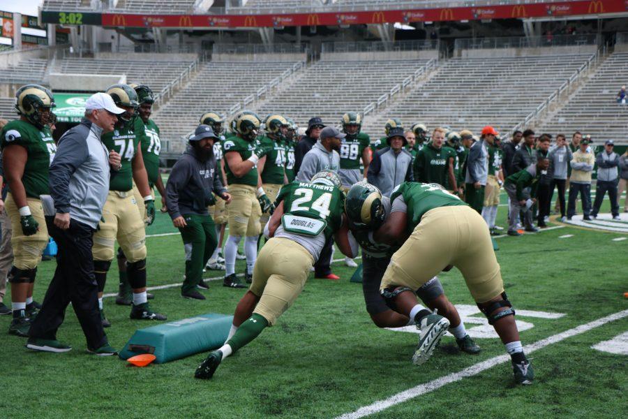 Izzy Mathews as he runs throught the gauntlet at the spring game. ( Devin Cornelius | Collegian)