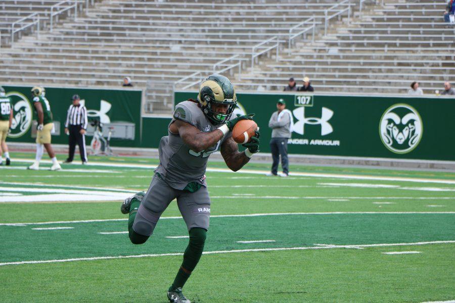 A CSU player cathes the fooball during the spring football game. (Devin Conelius | Collegian)
