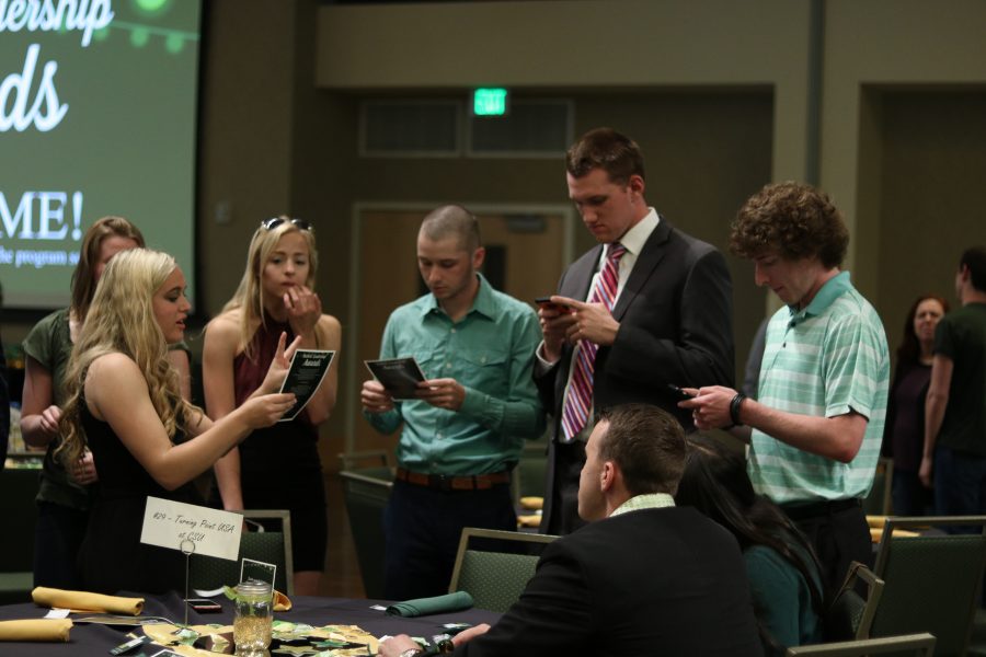 Students discuss the agenda for the award ceremony (Devin Cornelius | Collegian)
