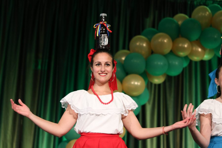 A member of the Latin American Students and Scholars Association smiles as she dances during the award ceremony. (Devin Cornelius | Collegian)