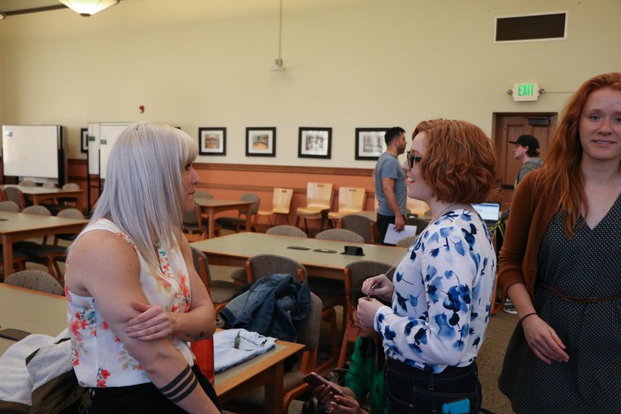 Destiny Burnsworth and Ashley VanDyke chat as the awards lunch continues.(Devin Cornelius | Collegian)