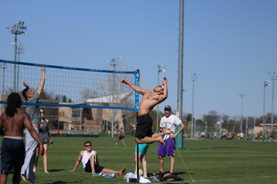 A student jumps for a spike during the RAMslam volleyball tournament. (Devin Cornelius | Collegian)