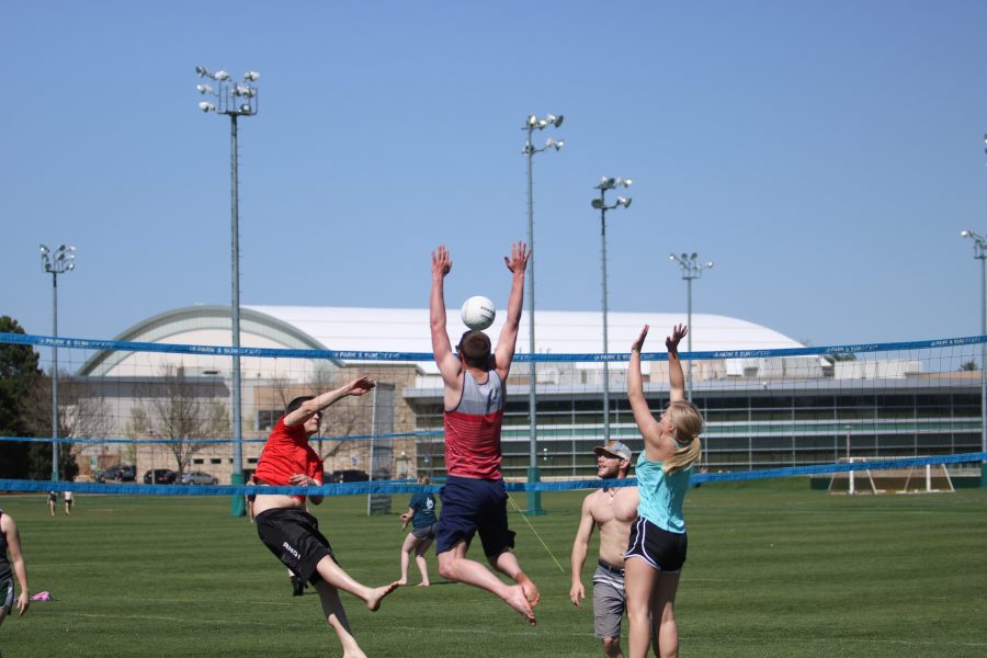 A student attempt to block the ball as it heads towards their side. (Devin Cornelius | Collegian)