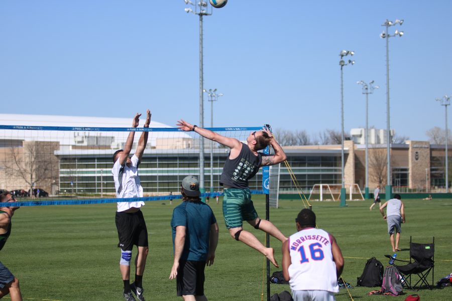 A student jumps for a spike during the RAMslam volleyball tournament. (Devin Cornelius | Collegian)