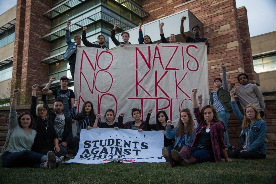 Students Against White Supremacy, a coalition of students who aim to expose and remove white supremacy on campus, hold the banners theyve been displaying for events like disrupting CSUnite and tabling on the plaza to further education on these issues. (Julia Trowbridge | Collegian)
