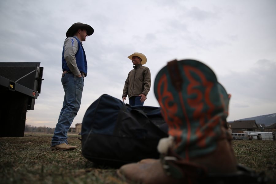 The United States Air Force Academy's Bailey Smith, left, and Jesse Maese, right, share a laugh before the 68th annual Skyline Stampede rodeo on April 7, 2018 at the B.W. Pickett Arena in Fort Collins.  (Forrest Czarnecki | The Collegian)
