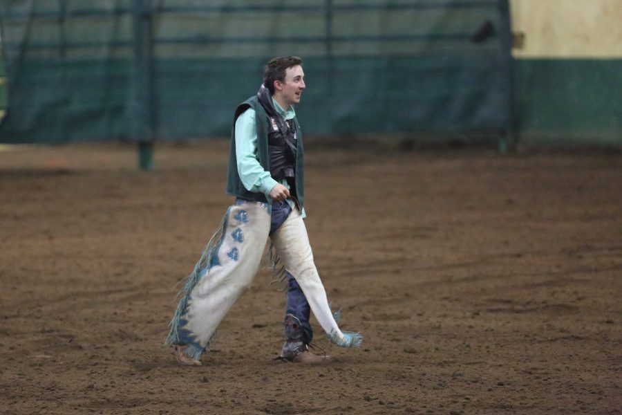 Colorado State University's Austin Reynolds walks back to the chutes after riding in the bareback event at the 68th annual Skyline Stampede rodeo on April 7, 2018 at the B.W. Pickett Arena in Fort Collins.  (Forrest Czarnecki | The Collegian)
