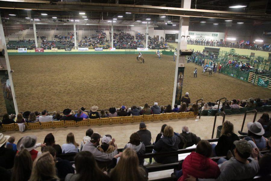 The saddle bronc riding event  is seen from the stands at the 68th annual Skyline Stampede rodeo on April 7, 2018 at the B.W. Pickett Arena in Fort Collins.  (Forrest Czarnecki | The Collegian)