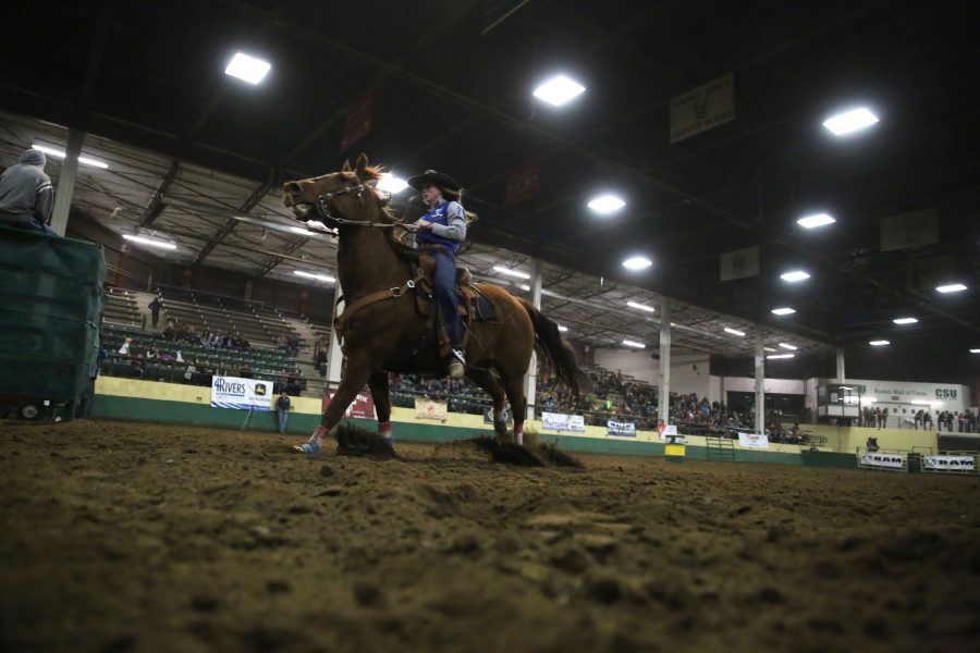 Anna Maronick, from the United States Air Force Academy, competes in barrel racing at the 68th annual Skyline Stampede rodeo on April 7, 2018 at the B.W. Pickett Arena in Fort Collins.  (Forrest Czarnecki | The Collegian)