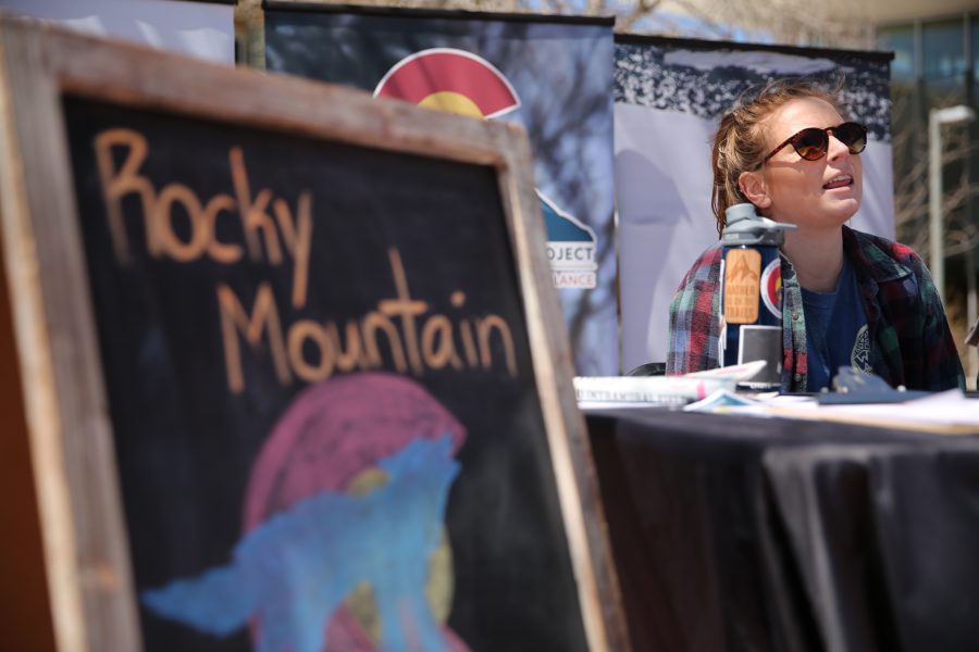 Amy Nelson, with the Rocky Mountain Wolf Project, talks about the logistics of reintroducing wolves into the state of Colorado during Earth Week on the plaza on April 25, 2018.  (Forrest Czarnecki | The Collegian)