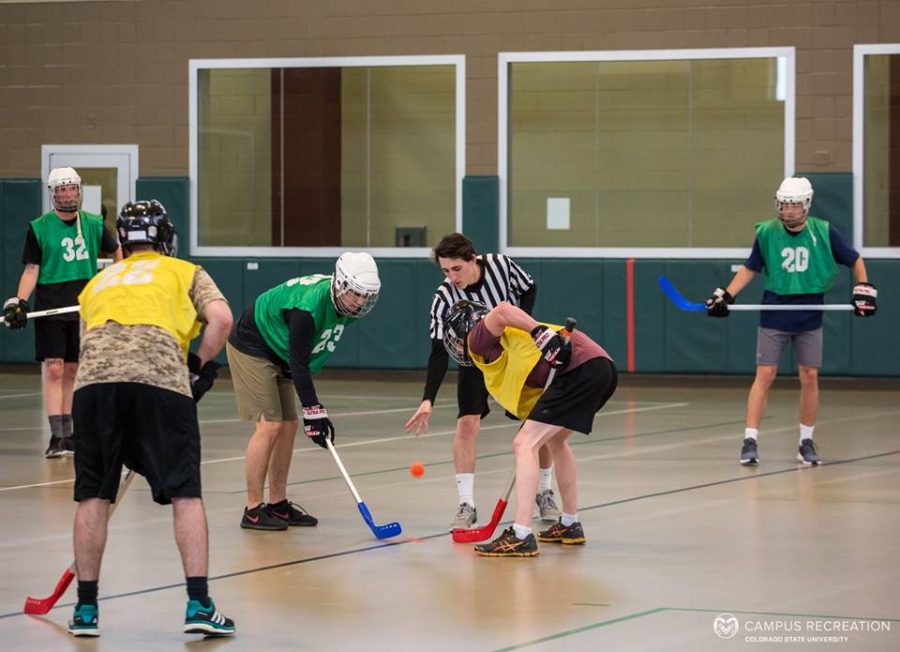 IM Floor Hockey competing in April 2018. (Photo by Jacob Butler, Campus Recreation photographer)