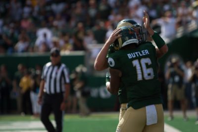 Tight end Cameron Butler embraces a teammate after scoring a touchdown against Oregon State game on Aug. 26, 2017. (Tony Villalobos May | Collegian)