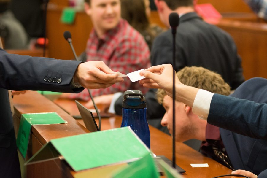 Members of the ASCSU Senate receive voting ballots on May 2 to vote on the new Chief Justice Madison Taylor. (Colin Shepherd | Collegian)
