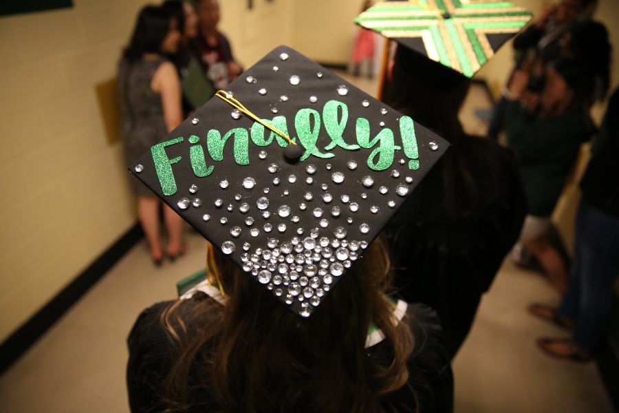 A Colorado State University graduate shows off her decorated cap after a graduation ceremony on May 12, 2018 at Moby Arena.  (Forrest Czarnecki | The Collegian)