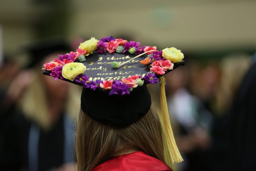 A Colorado State University graduate shows off her decorated cap before the graduation ceremony for the College of Agricultural Sciences on May 12, 2018 at Moby Arena.  (Forrest Czarnecki | The Collegian)
