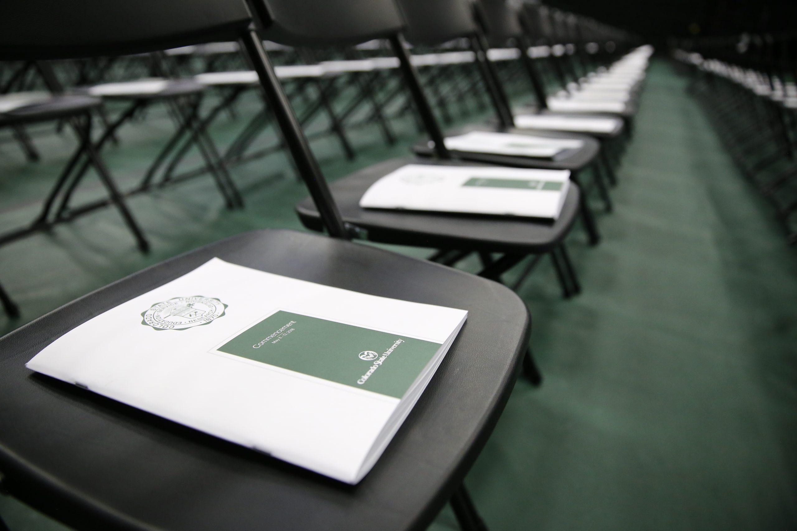 Programs sit on seats in Moby Arena.