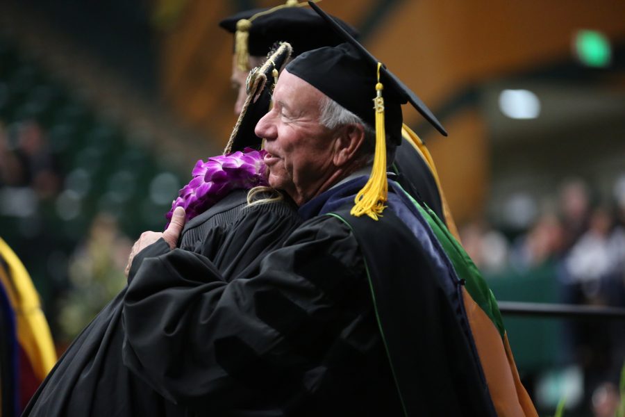 Colorado State University professor Jerry Black hugs a graduate after they received their diploma during the graduation ceremony for the College of Agricultural Sciences on May 12, 2018 at Moby Arena.  (Forrest Czarnecki | The Collegian)