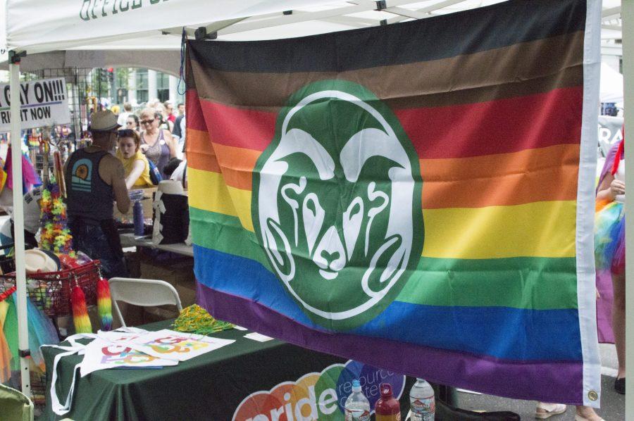 A rainbow CSU flag hangs from the Pride Resource Center tent at Denver PrideFest Saturday, June 16, 2016. The Pride Resource Center aims to provide an inclusive space for CSU students who identify with the LGBTQ community. (AJ Frankson | Collegian)