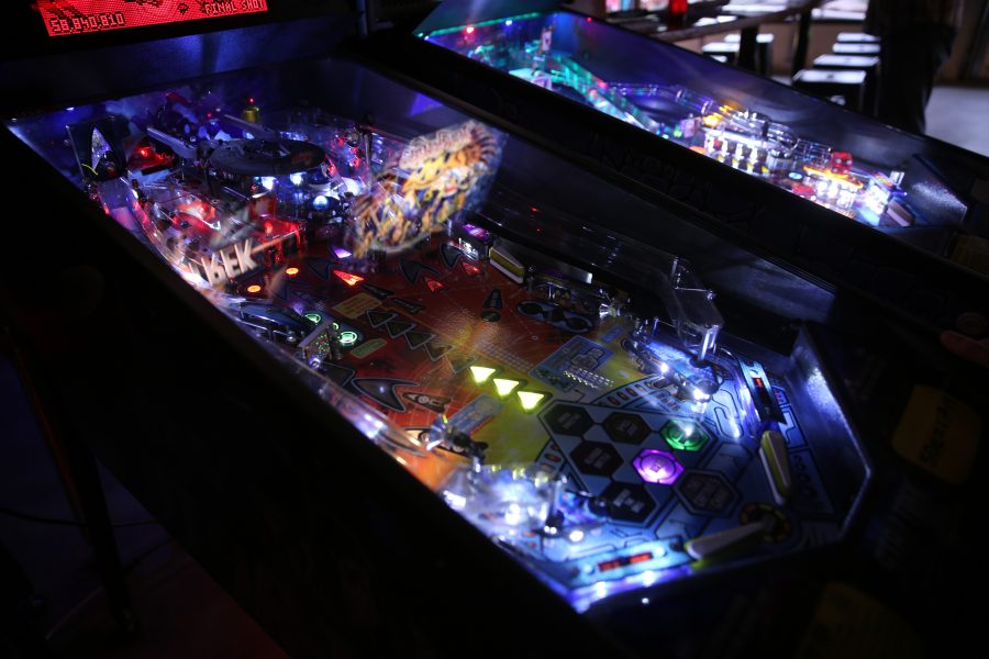 A pinball machine is pictured in action at the Pinball Jones Campus West location.  (Forrest Czarnecki | The Collegian)