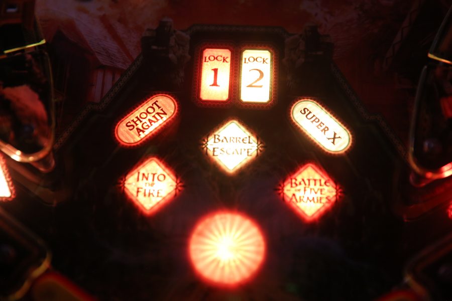A pinball machine lights up at the end of a round at the Pinball Jones Campus West location.  (Forrest Czarnecki | The Collegian)