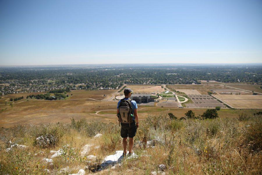 In this file photo Colorado State University student Josh Billups, seeking a Chemical Engineering major, takes in the view from atop the famous A on the west side of Fort Collins on Aug. 21, 2017. The hike to the A was run by the Outdoor Program as a continuation of the Ram Welcome activities for all incoming students at Colorado State University. (Forrest Czarnecki | The Collegian)