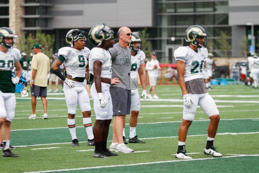 Defensive Coordinator John Jancek watches a defensive drill at practice on August 2. (Ashley Potts | Collegian)