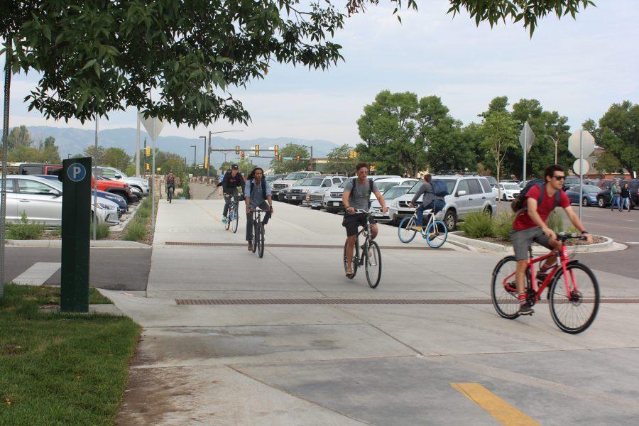 Student bikers ride on the Green Trail extension after its grand opening on Aug. 21. (Clara Scholtz | Collegian)