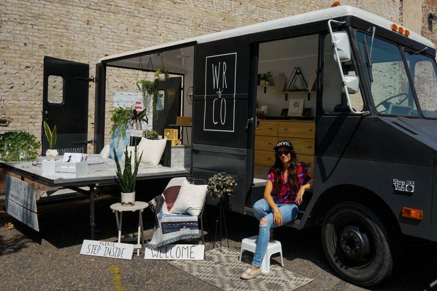 Ali Rose poses outside her pop-up shop. The van allows her to set up shop in multiple places around Fort Collins. (Lauryn Boltz | Collegian) 