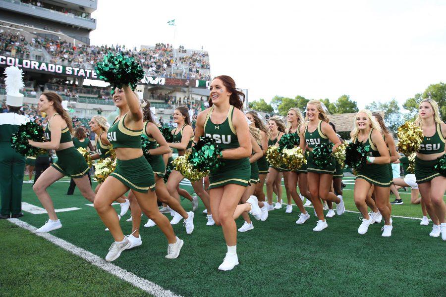 The Colorado State Cheerleaders run out of the tunnel ahead of the football team prior to the game against the Hawaii Rainbow Warriors at Canvas Stadium on August 25, 2018 in Fort Collins, CO. (Elliott Jerge | Collegian)