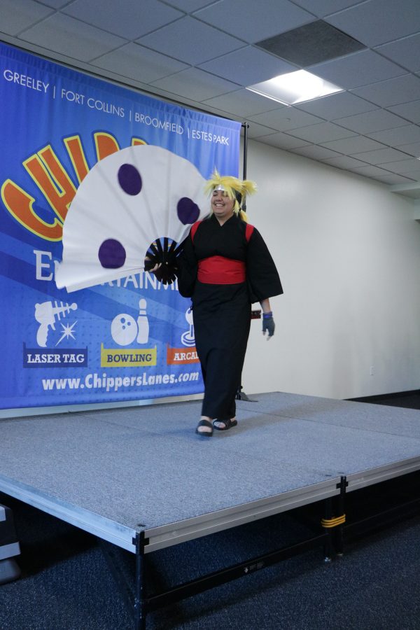 Arielle poses on the catwalk at the Comc Con dressed as Temari from the anime naruto. (Devin Cornelius | Collegian)