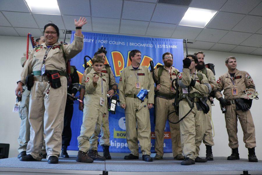 The Ghostbusters of Colorado United pose on stage at the Comic Con catwalk. (Devin Cornelius | Collegian)