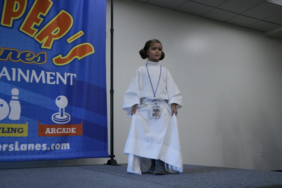 Ariel a participant in the Fort Collins comic con cosplay catwalk poses for the audience in her Princess Leia costume. (Devin Cornelius | Collegian)
