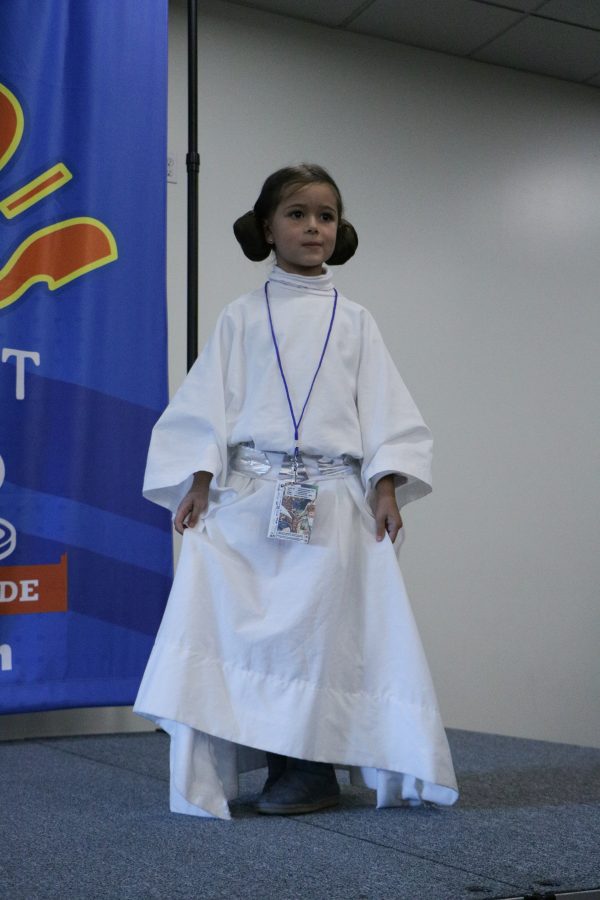 Ariel a participant in the Fort Collins comic con cosplay catwalk poses for the audience in her Princess Leia costume. (Devin Cornelius | Collegian)