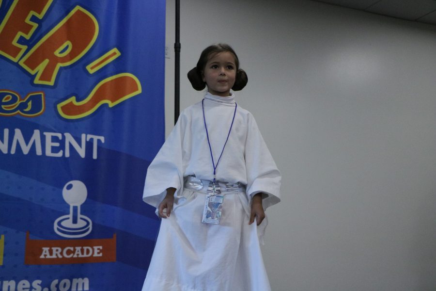 Ariel a participant in the Fort Collins comic con cosplay catwalk poses for the audie,nce in her Princess Leia costume. (Devin Cornelius | Collegian)