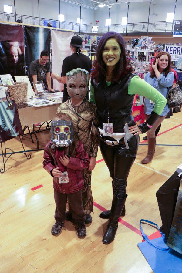 A mom poses with her children while dressed like Gamora from guardians of the galaxy. (Devin Cornelius | Collegian)