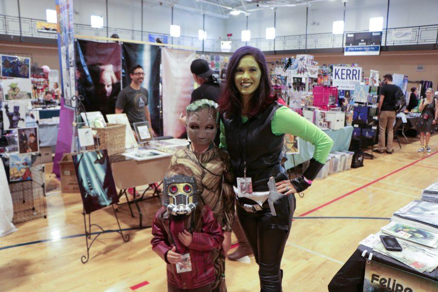 A mom poses with her children while dressed like Gamora from guardians of the galaxy. (Devin Cornelius | Collegian)